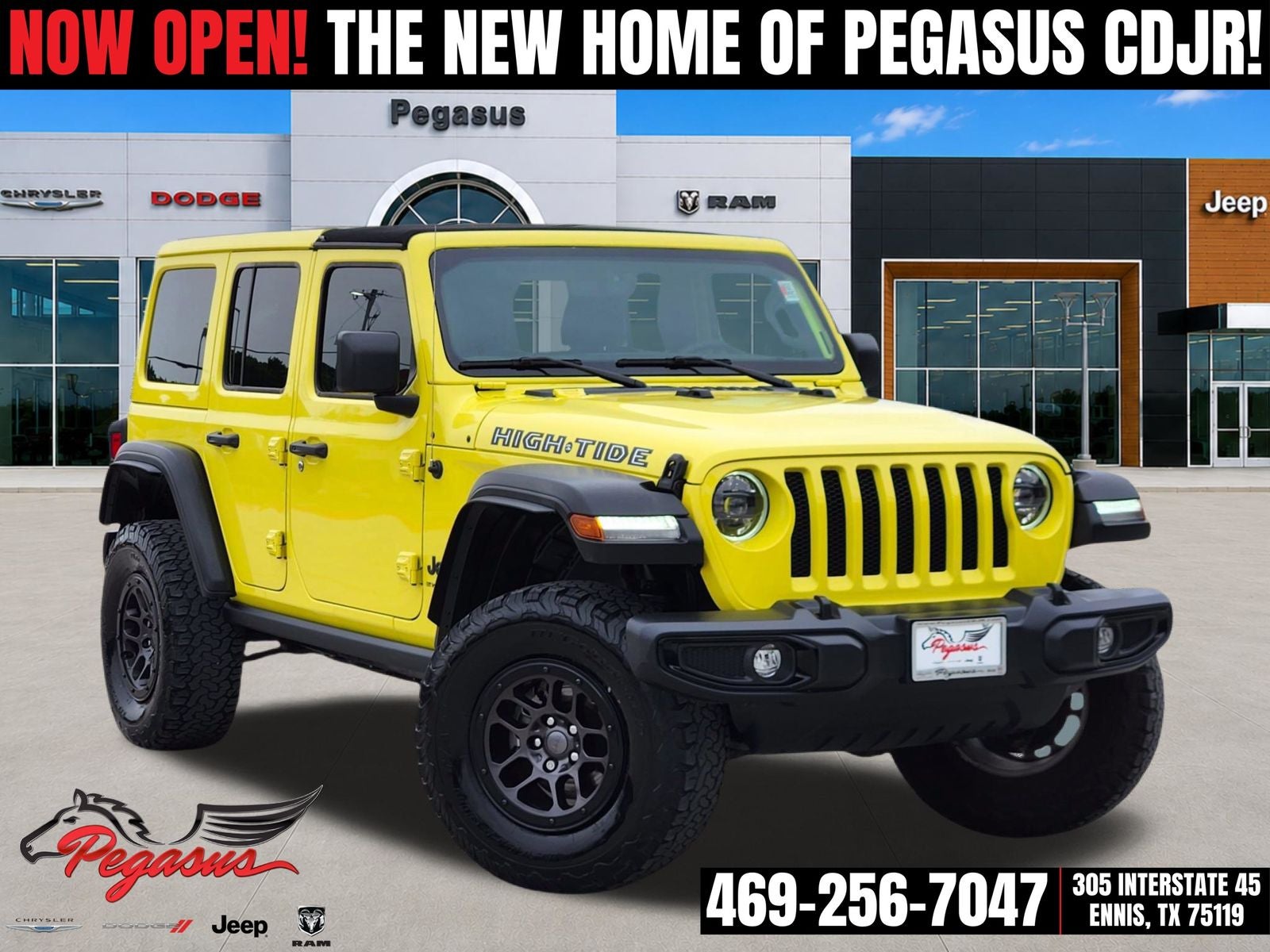 2023 Jeep Wrangler 4-Door High Tide 4x4 in High Velocity Clearcoat — front three-quarter view
