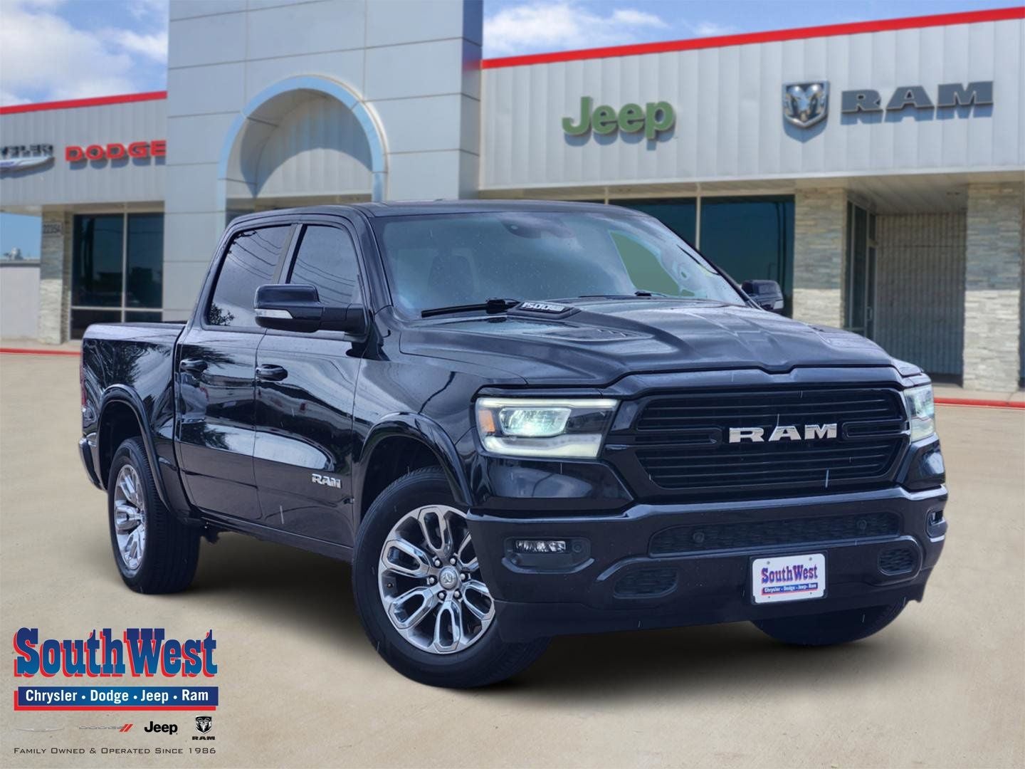 2022 RAM Ram 1500 Laramie Crew Cab 4x2 5'7' Box in Diamond Black Crystal Pearlcoat — front three-quarter view