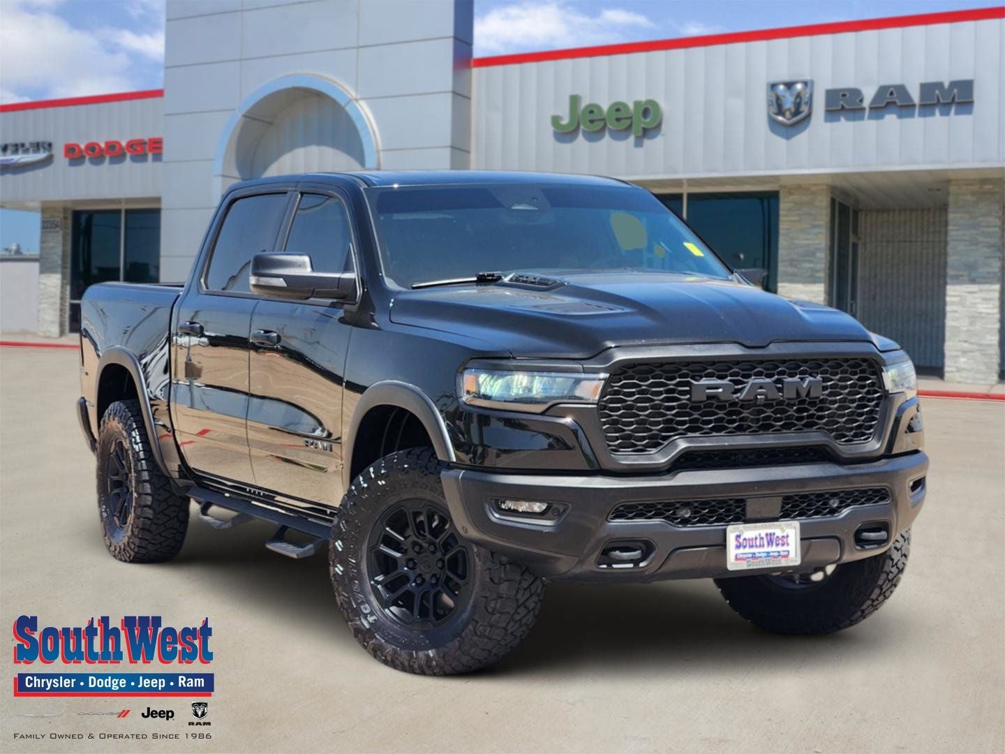 2025 RAM Ram 1500 Rebel Crew Cab 4x4 5'7' Box in Diamond Black Crystal Pearlcoat — front three-quarter view