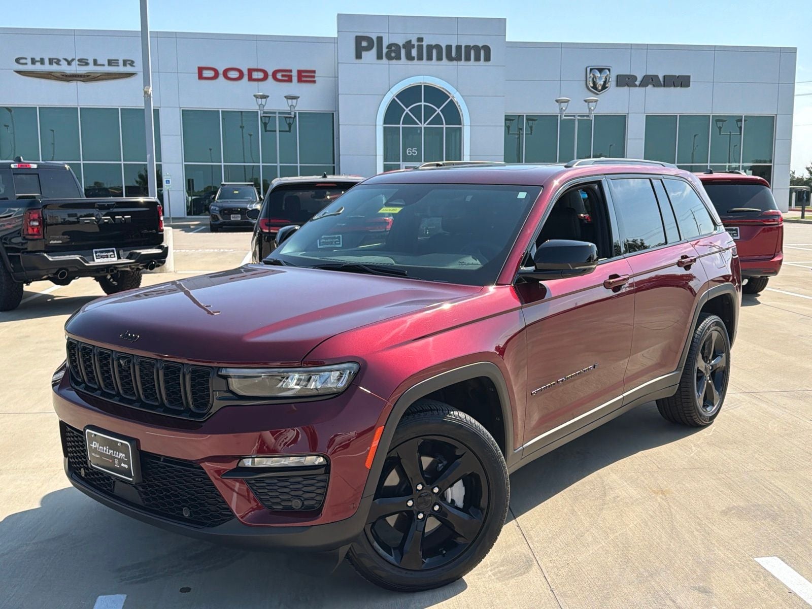 2025 Jeep Grand Cherokee Limited 4x4 in Velvet Red Pearlcoat — front three-quarter view