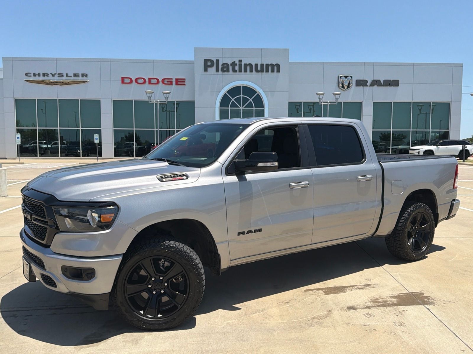 2022 RAM Ram 1500 Lone Star Crew Cab 4x4 5'7' Box in Billet Silver Metallic Clearcoat — front three-quarter view