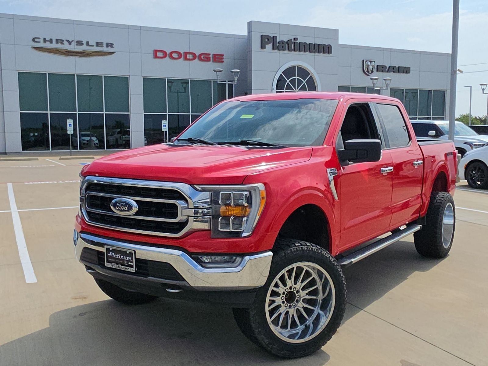 2021 Ford F-150 XLT in Race Red — front three-quarter view