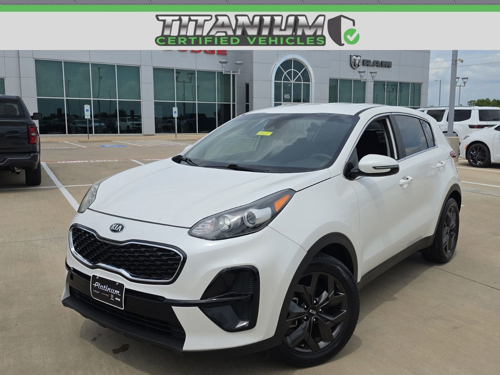 2022 Kia Sportage LX in Snow White Pearl — front three-quarter view