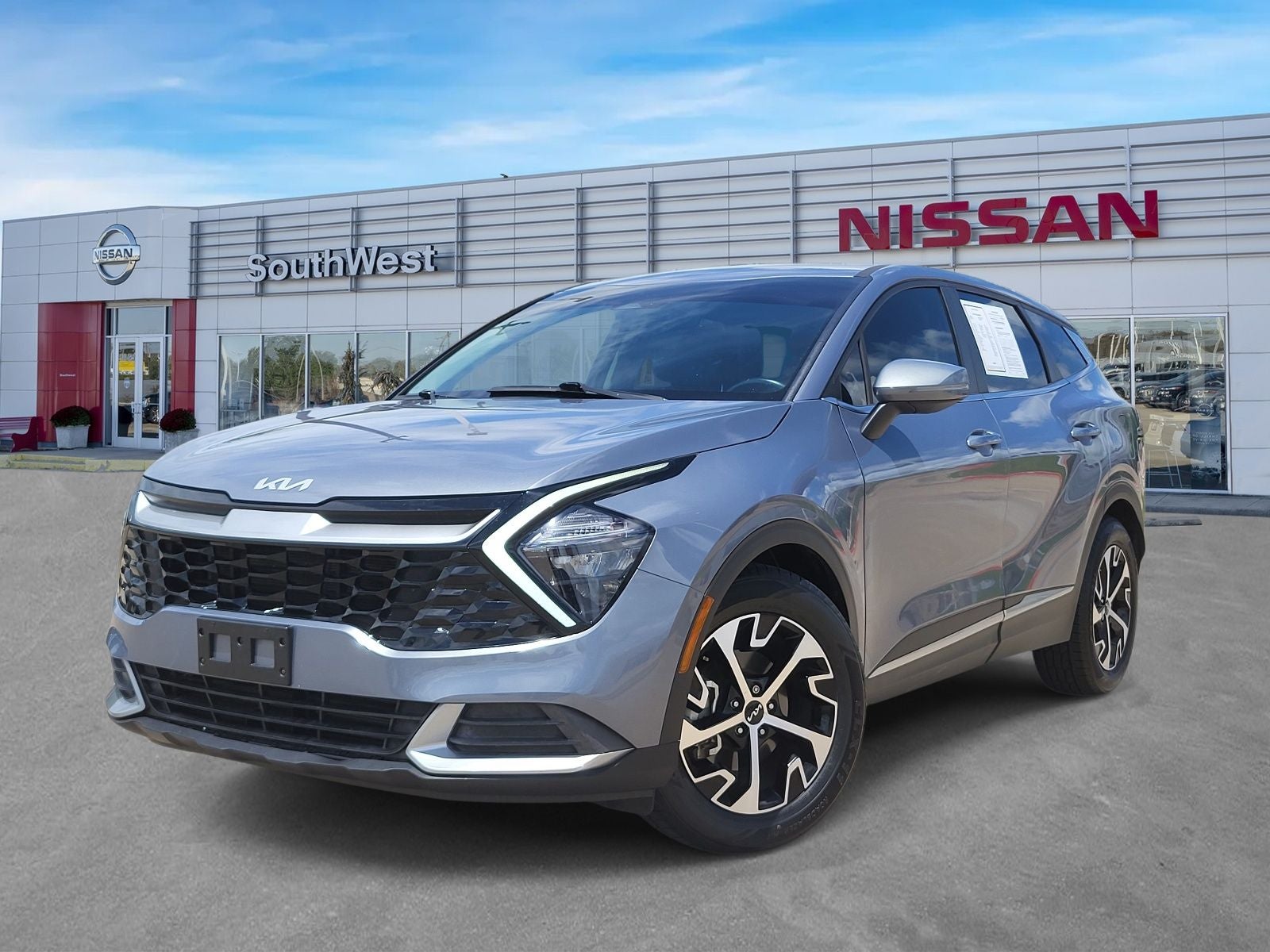 2023 Kia Sportage EX in Everlasting Silver — front three-quarter view