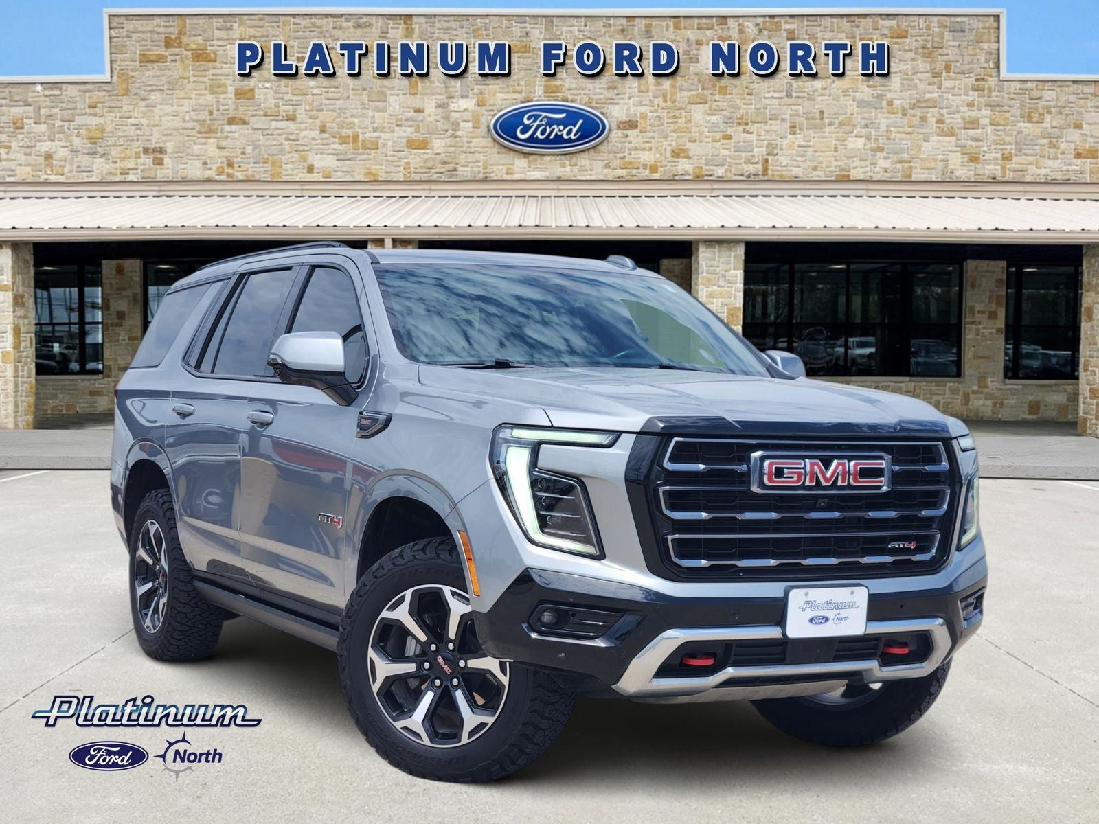 2025 GMC Yukon AT4 in Sterling Metallic — front three-quarter view
