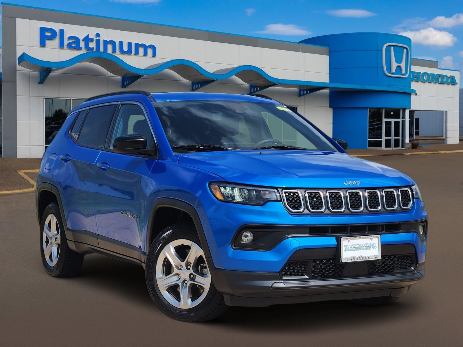 2024 Jeep Compass Latitude in Hydro Blue Pearlcoat — front three-quarter view