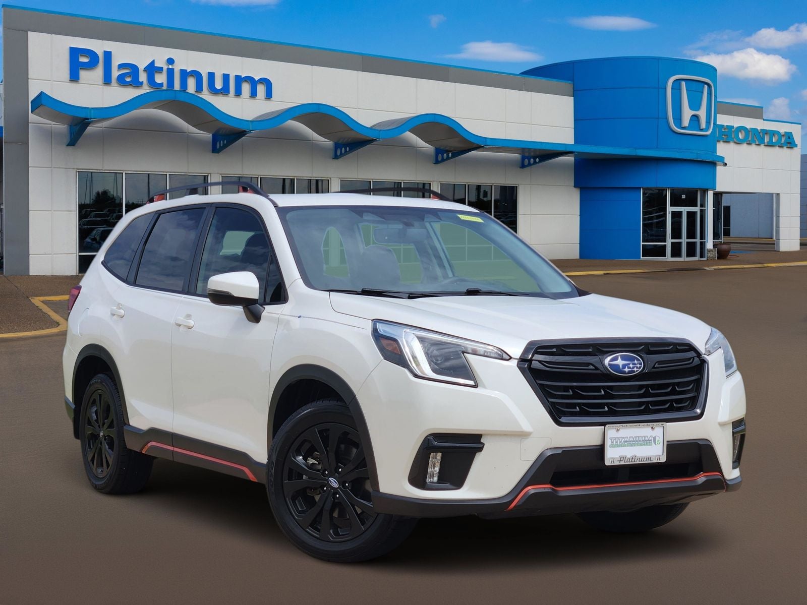 2024 Subaru Forester Sport in Crystal White Pearl — front three-quarter view