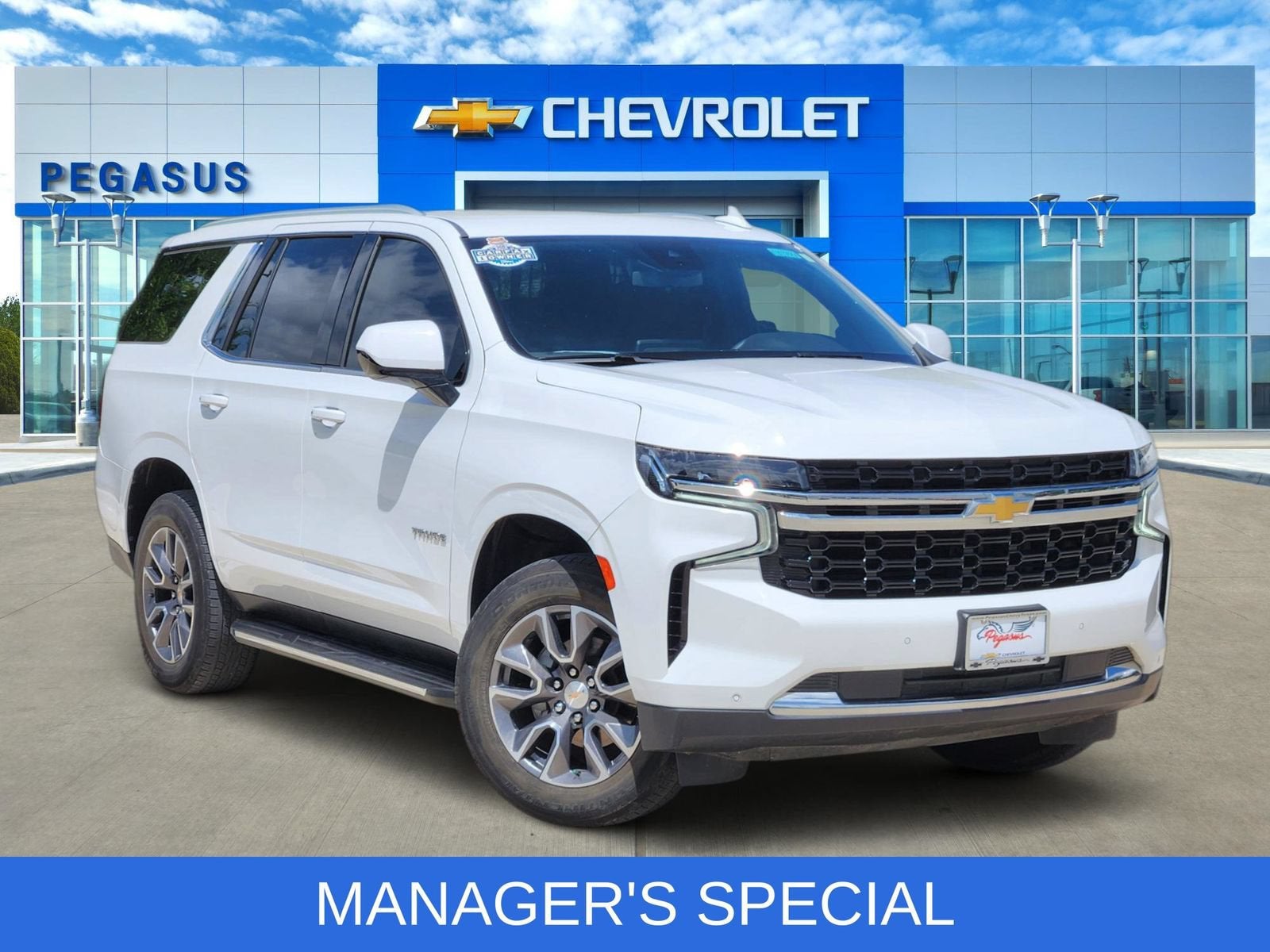 2024 Chevrolet Tahoe LS in Summit White — front three-quarter view