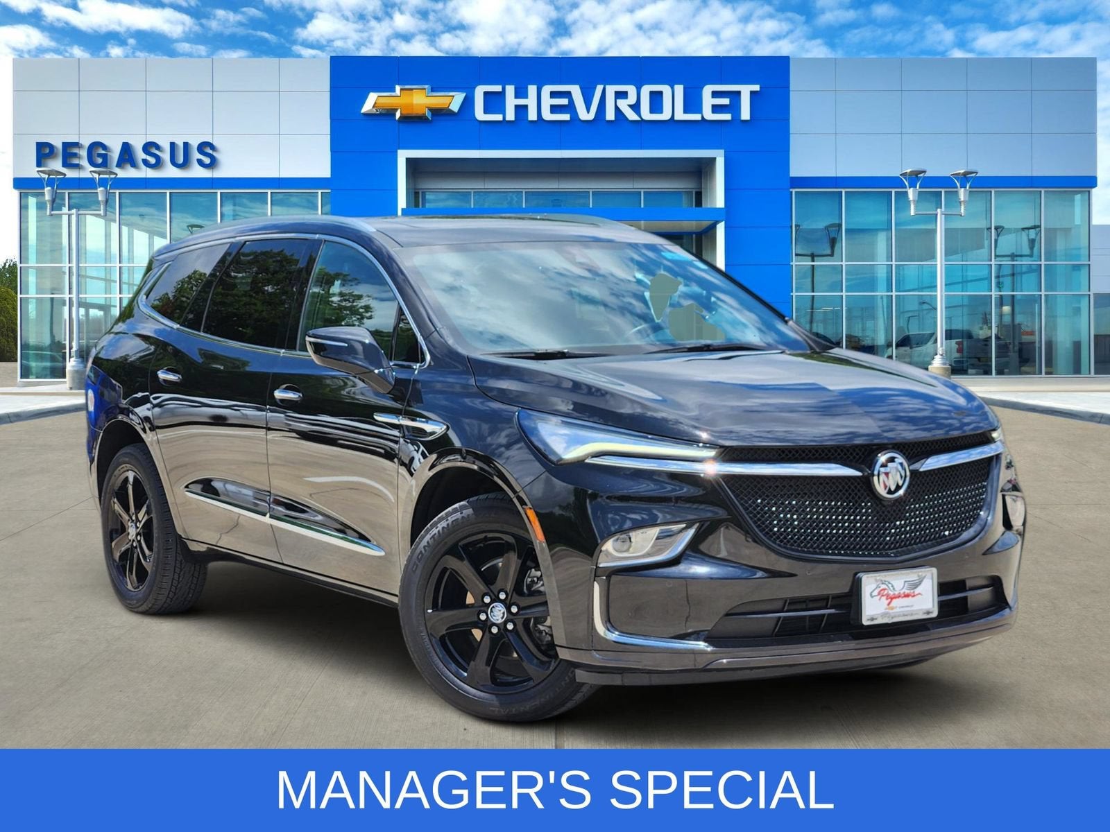 2024 Buick Enclave Essence in Ebony Twilight Metallic — front three-quarter view